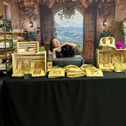 Amanda at the farmers market stall